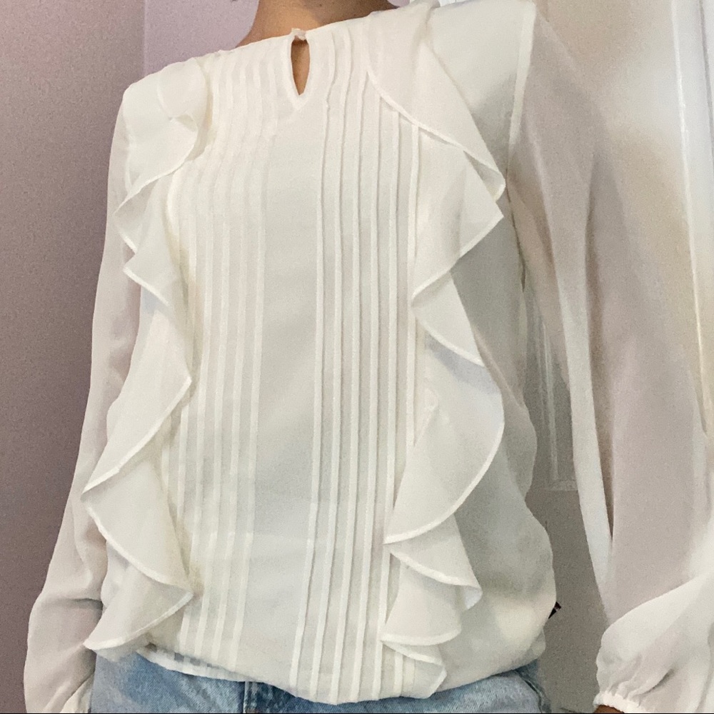 Ruffled white blouse